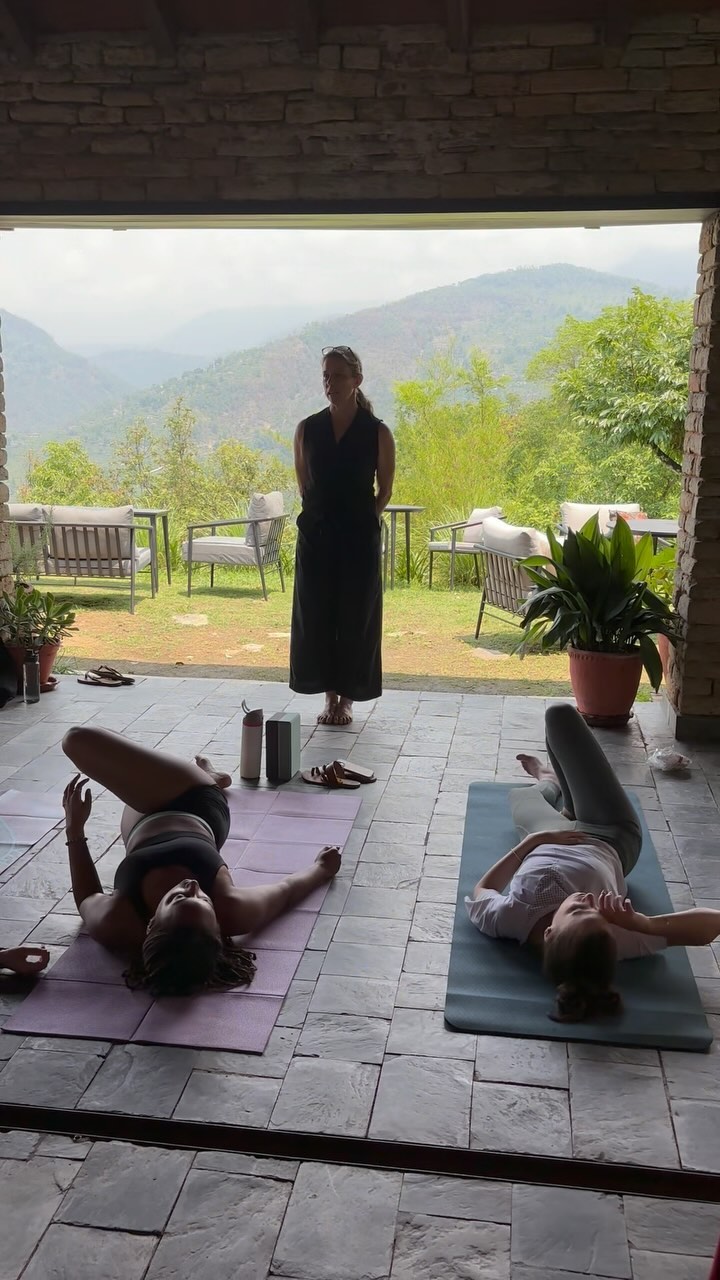 Laura Dudley instructing a yoga and mindfulness class, standing